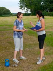 Penny Pearce giving a briefing to a client